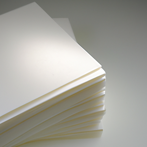 A stack of blotting paper with a matte finish reflecting light.